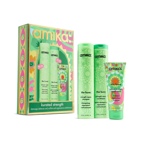 amika Kurated Strength set with The Kure shampoo, conditioner and mask beside the gift box