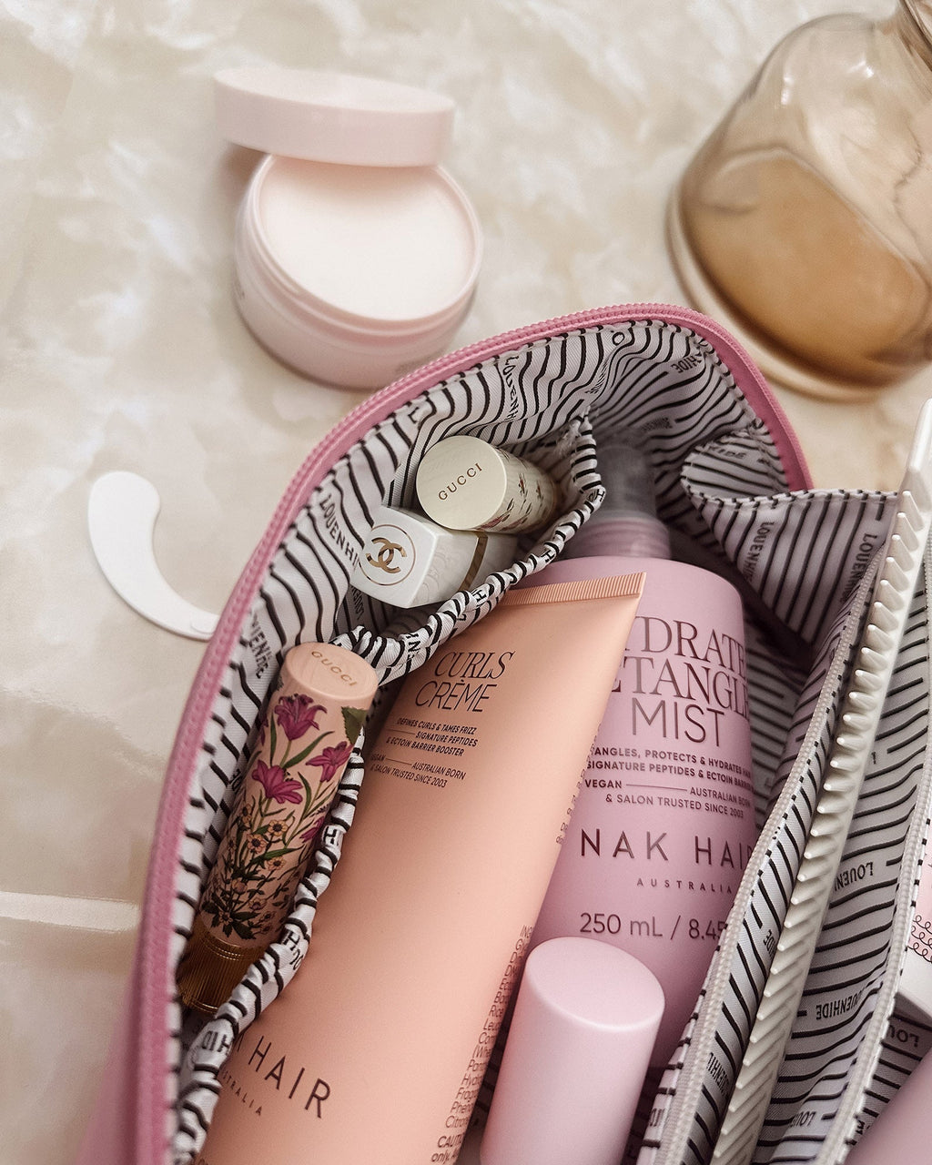 Louenhide Mary cosmetic bag in bubblegum pink, open flat