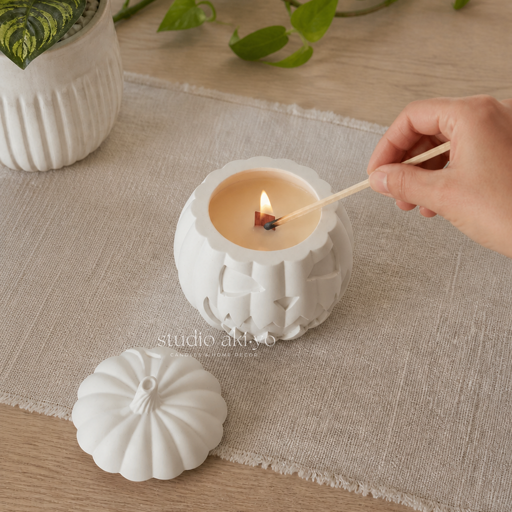 Hand lighting the Studio Akiyo Pumpkin Hollow candle