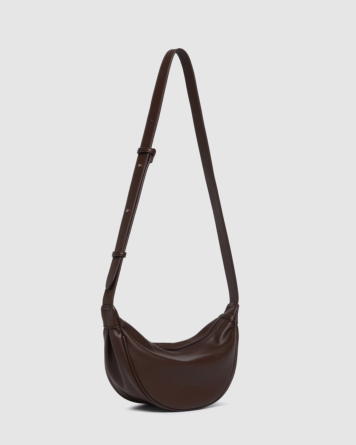 Louenhide Sylvia sling bag in chocolate, worn