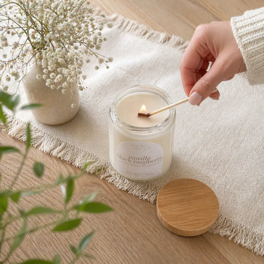 Studio Akiyo soy candle lit on a table